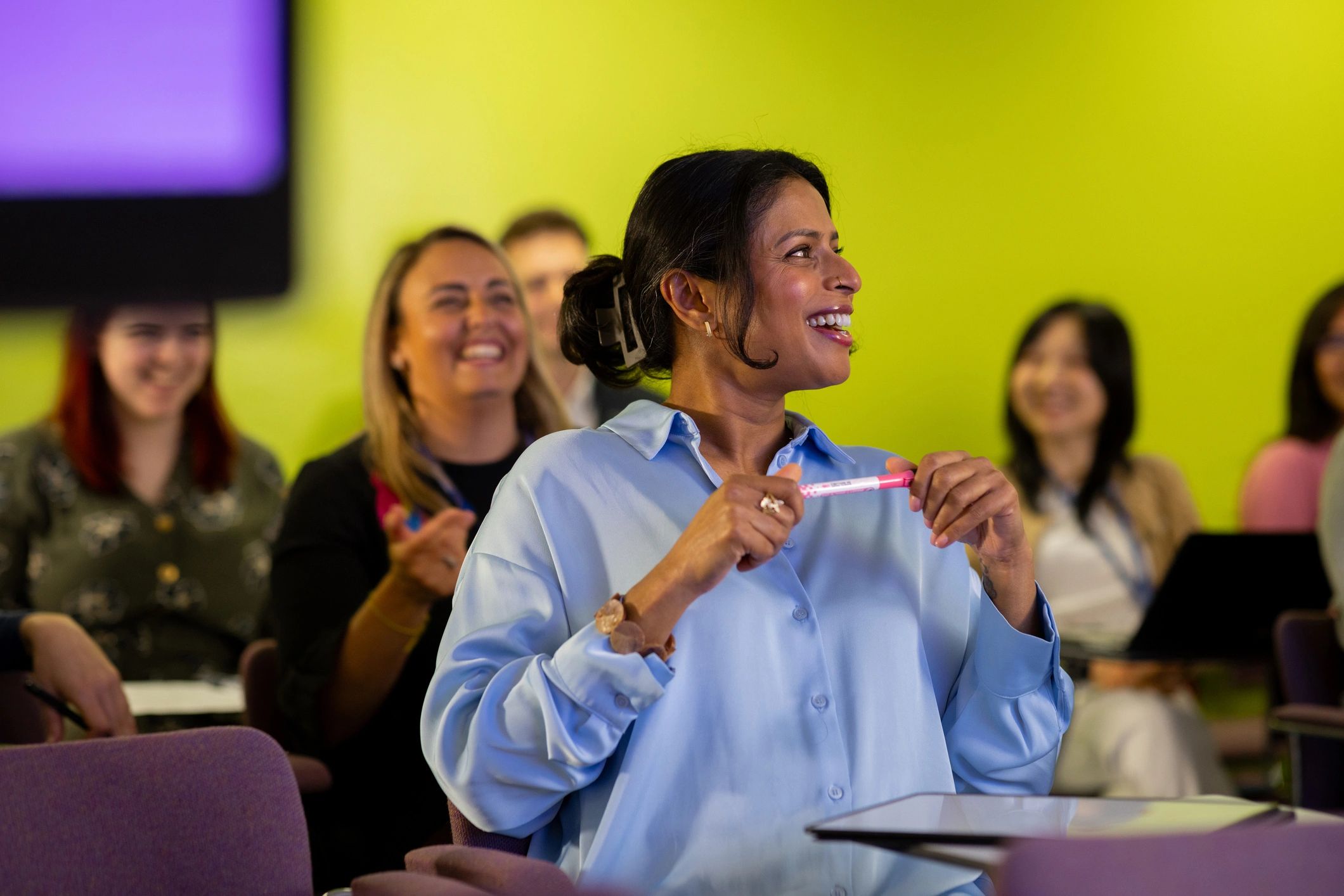 Professionals learning together at a seminar